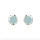 A pair of minimalist round stud earrings with a polished silver-tone bezel and a light blue-green center, displayed on a clean white background with a soft reflection.