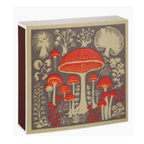 A square decorative box with a vintage-style illustration of red mushrooms and botanical motifs on a dark gray front panel, with a cream border and a dark reddish-brown side edge, shown on a white background.